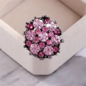Vintage flower cluster ring featuring pink and magenta crystals set in black gunmetal finish