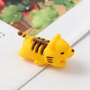 Close-up of a yellow cartoon animal cable protector for mobile phone charging cables