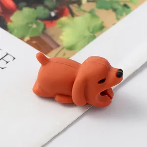 Close-up detail of a cute orange puppy cartoon silicone charging cable protector