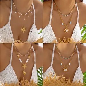Bohemian gold layered stainless steel necklace with ocean sun and turtle shell pendants
