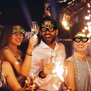 Friends celebrating New Year wearing 2027 black gold themed paper party glasses
