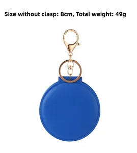 Detail of 8cm blue round PVC mirror keychain showing texture and 49g weight spec