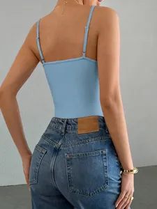 Back view of a light blue camisole bodysuit paired with high-waisted denim jeans.