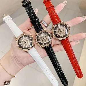 Detailed view of fashion women watches with leather straps and rhinestone floral dials