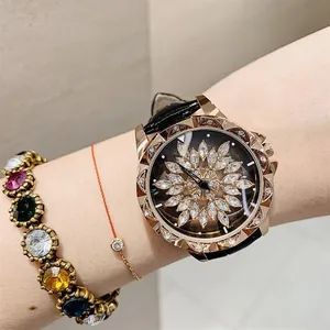Close-up of rose gold watch with crystal flower dial and black leather strap