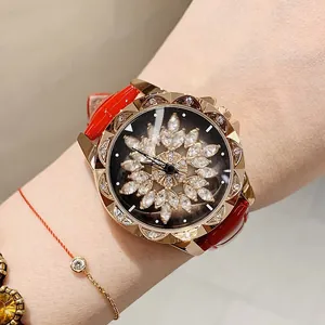 Elegant rotating snowflake dial watch for women with red leather strap and rhinestones