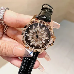 Women's rose gold watch with black leather strap and rotating zircon flower dial