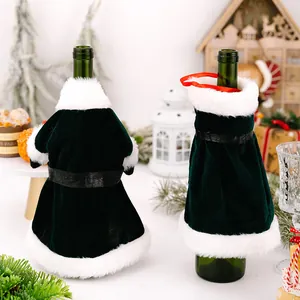 Detailed view of dark green velvet Christmas wine bottle covers with white faux fur trim.