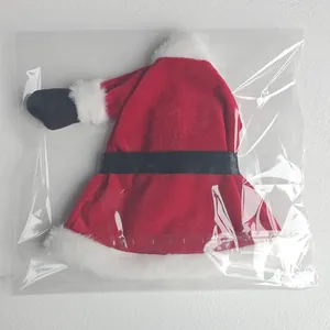 Santa Claus themed red wine bottle cover mini dress inside clear plastic packaging