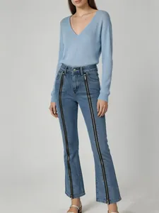 Full view of blue micro-flare jeans for women featuring unique front zipper design