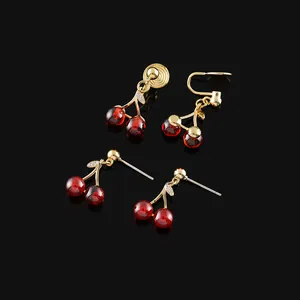 Elegant red cherry stud and mosquito coil clip-on earrings with gold-toned finish