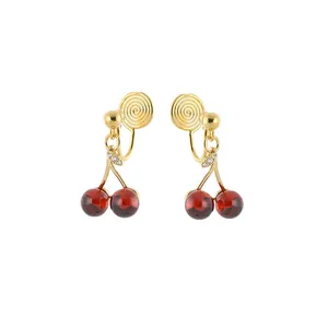 Pomegranate red cherry clip-on earrings with gold mosquito coil design for non-pierced ears.