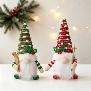 Handmade knitted Christmas gnomes with warm glowing LED lights and festive hats