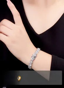 Close-up of a sparkling moissanite tennis bracelet crafted in S925 silver on a model's wrist