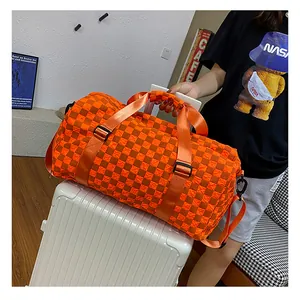 Large capacity orange and brown checkered duffel bag for travel, sports and short business trips