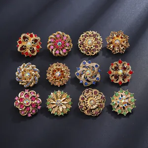 Set of 12 vintage floral brooches with colorful rhinestones on gold alloy base