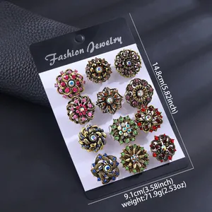 Set of 12 vintage flower brooches with colorful rhinestones on fashion jewelry cards