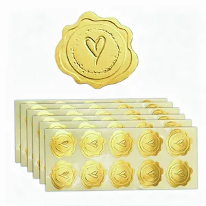 Detailed view of multiple sheets of gold heart-shaped wax seal stickers for gift wrap