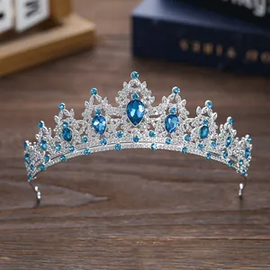 Macro detail of Baroque silver bridal crown with blue gemstones and white crystals
