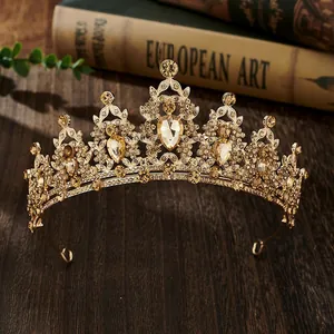 Macro detail of golden baroque crown with champagne diamonds and pear-cut gemstones
