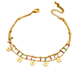 Gold double-layered chain bracelet with colorful flower charms and adjustable clasp