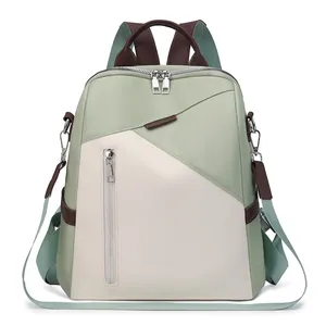 Detail of the mint green and cream patchwork backpack with water-resistant fabric