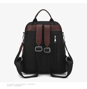 Detail view of anti-theft back zipper and black nylon fabric on fashion backpack