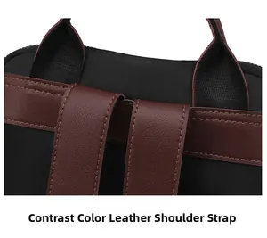Detail of contrast color leather shoulder straps and stitching on the black backpack