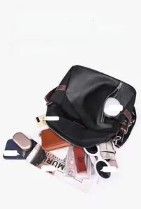 Flat lay of interior capacity showing A4 magazine, tablet, and daily essentials
