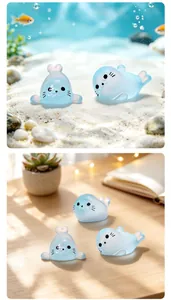 Detailed view of cute translucent blue seal figurines used for fish tank and desk decor.