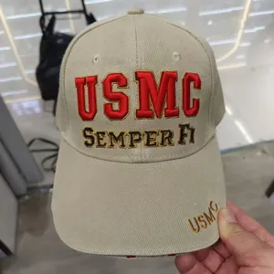 Close-up of USMC embroidery and Semper Fi slogan on a khaki tactical baseball cap