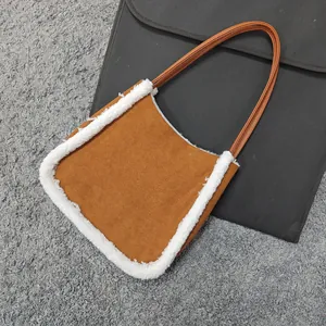 Detailed view of brown faux suede tote bag with white plush faux lamb wool trim texture