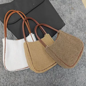 Three lamb wool handbags in white beige and coffee colors with leather straps