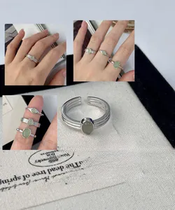 Elegant S925 sterling silver open ring featuring a clear light green oval crystal stone