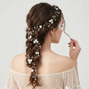 Handmade bridal hair vine with pearls and white flowers for elegant wedding hairstyles