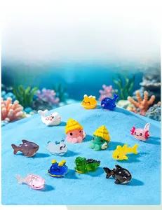 Colorful miniature marine animal figurines including shark, dolphin, and octopus