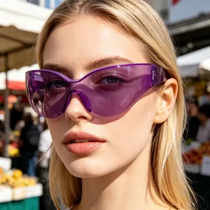 Close-up view of oversized purple wrap-around sports sunglasses worn by a female model