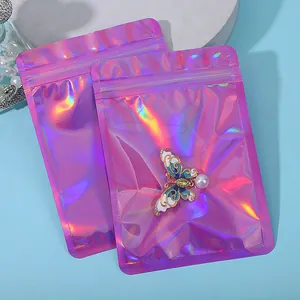 Detail showing pink holographic resealable bags with iridescent finish and jewelry
