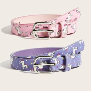 Close-up detail of pink and purple children's belts with unicorn prints and buckles