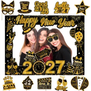 Close-up of black and gold 2027 New Year's Eve party photo booth props and photo frame