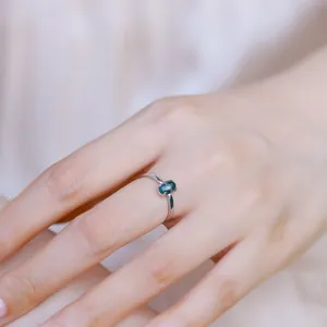 Minimalist 925 sterling silver adjustable ring featuring an oval synthetic opal stone