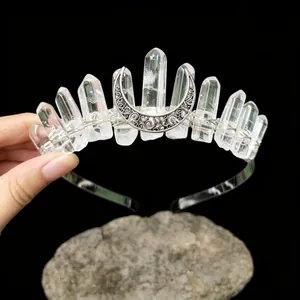 Detail of handcrafted white crystal crown with eleven quartz points and silver moon