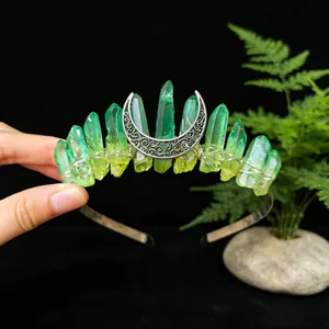 Macro detail showing handmade green gradient crystal headband with filigree crescent moon
