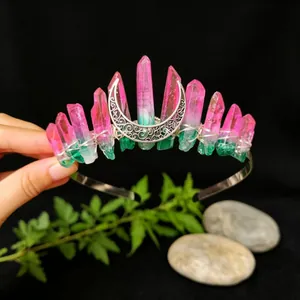 Close-up of a handmade pink and green gradient crystal crown headband with a silver moon