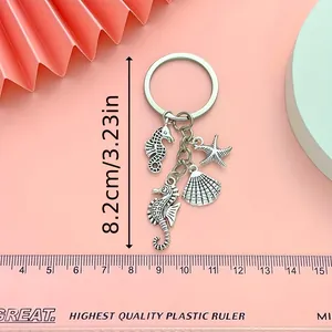 Detail showing ocean-themed seahorse starfish keychain dimensions with a size measurement line