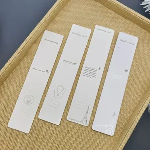 Detailed white jewelry display cards for stainless steel necklaces with Eiffel Tower print