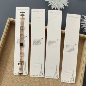 Minimalist gold stainless steel bracelets displayed on white quote paper cards