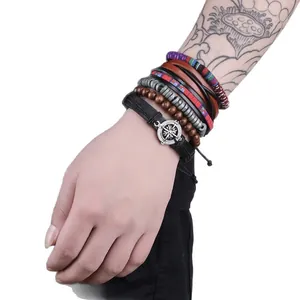 Handmade Bohemian multilayer woven leather bracelet set featuring a compass charm
