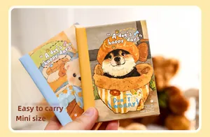 Close-up of A7 mini illustrated diary notebook featuring cute original dog art