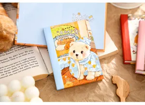Close-up of A7 notebook featuring a cute dog illustration in cozy blue hoodie.